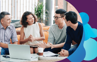 Group of people engaged in a discussion in front of a laptop Group of people engaged in a discussion in front of a laptop