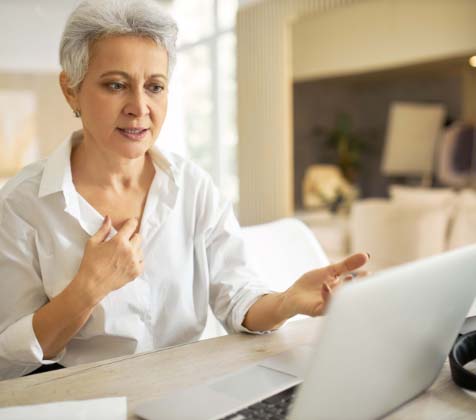 Board Director presenting an agenda in a virtual meeting Board Director presenting an agenda in a virtual meeting