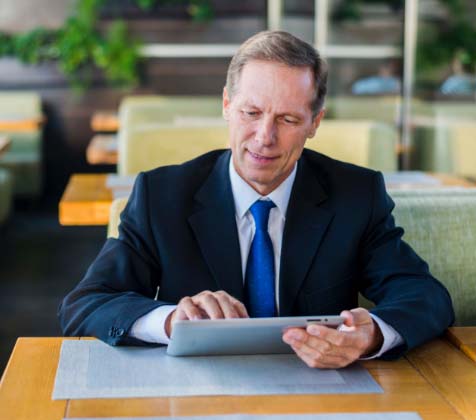 CEO using a tablet to access Convene remotely CEO using a tablet to access Convene remotely