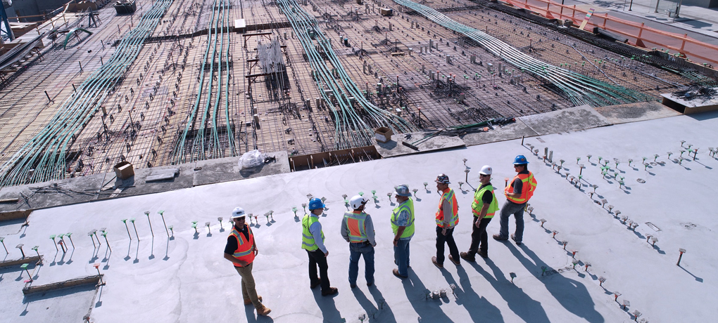 Engineers overlooking construction site