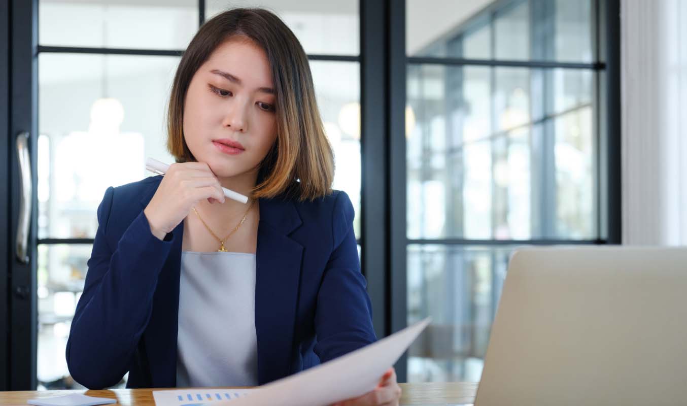 Company secretary looking at the documents for general meetings