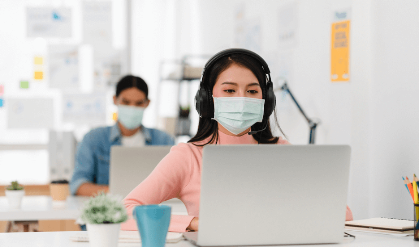 Employees working on-site in a hybrid workplace