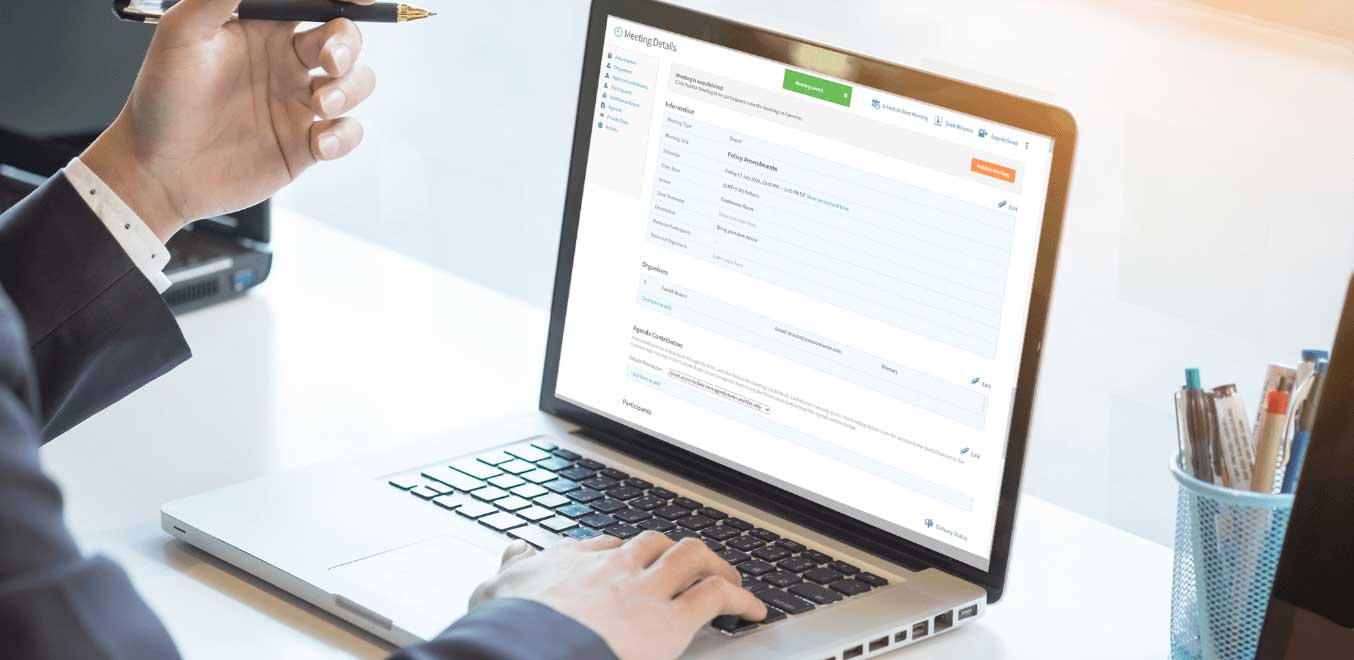 A board member using a board portal to access the board meeting