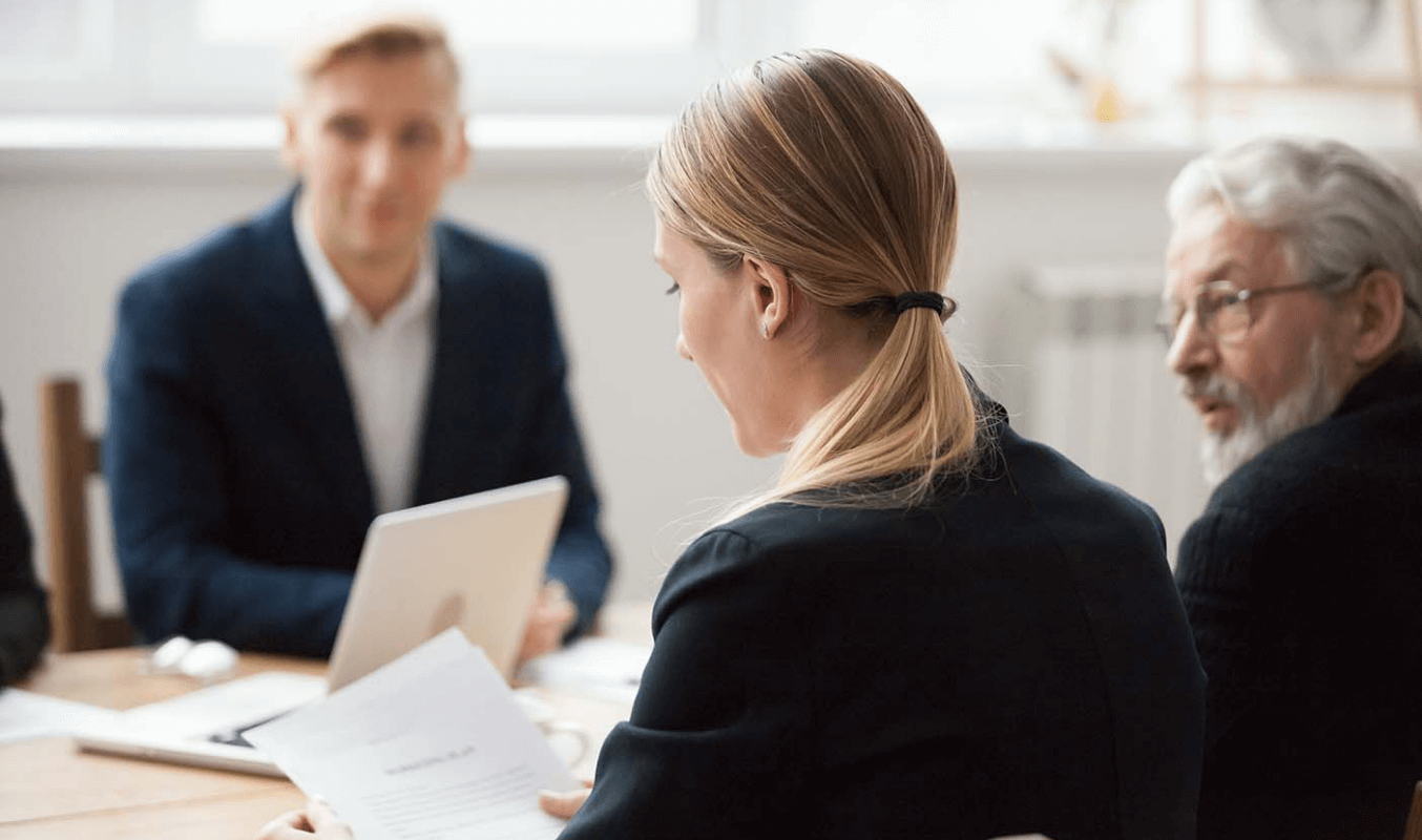 Board members collaborating to address corporate issues